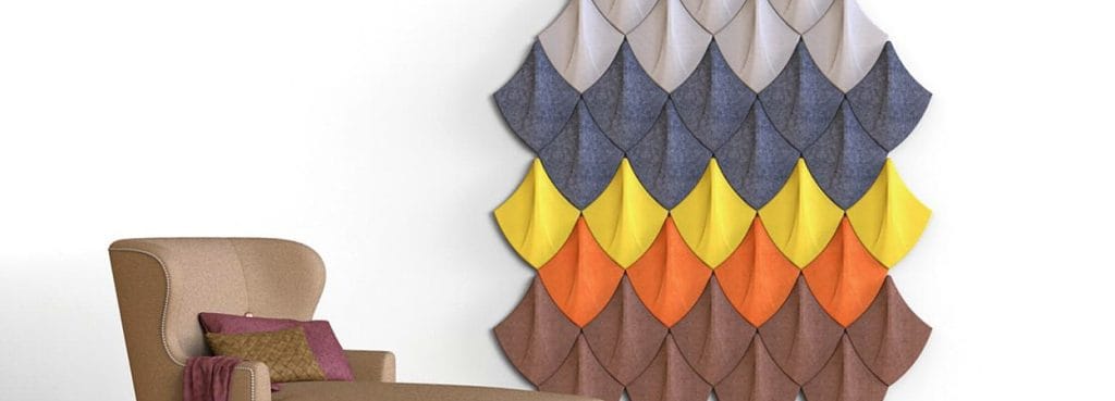 Shield Tec 3D acoustic wall panels in a colorful dragon-scale pattern made from textured PET felt.