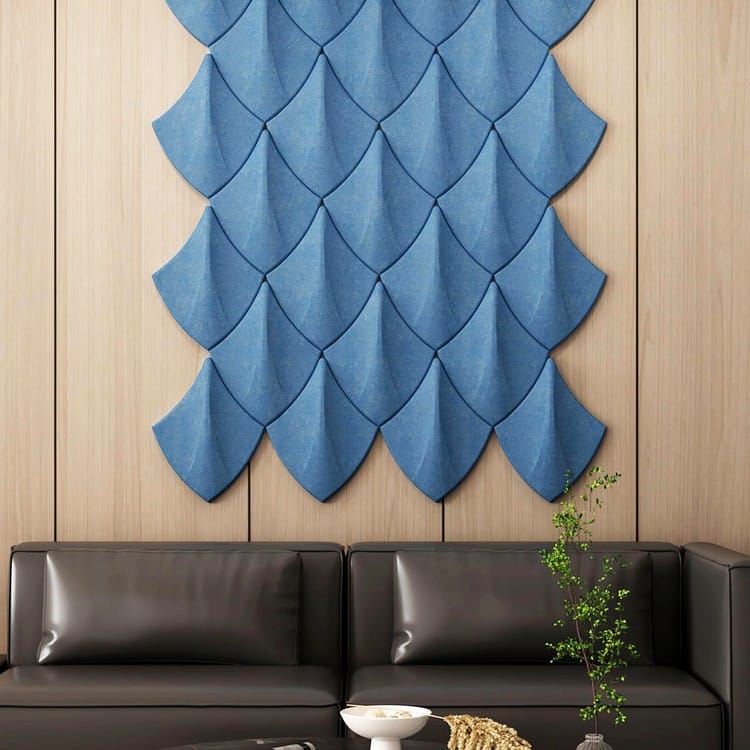 Blue Shield Tec acoustic felt panels arranged in a rhythmic, overlapping geometric formation on a light wood wall.