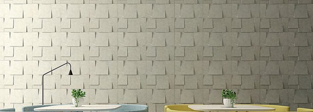 Slope 3D acoustic wall panel with gray felt, offset sloped rectangular blocks creating a shingled masonry pattern.