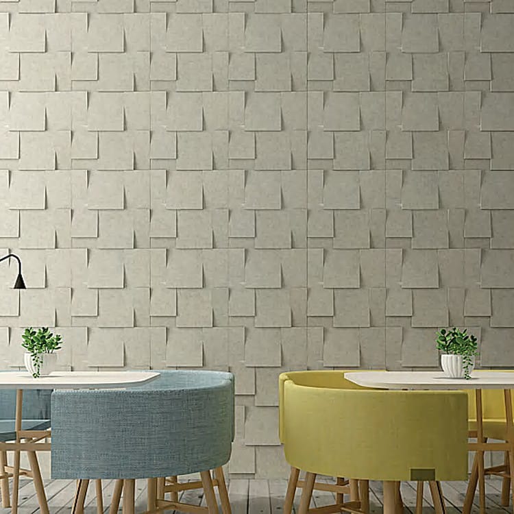 Slope 3D acoustic panels in a light neutral shade arranged in a dimensional, overlapping geometric pattern.