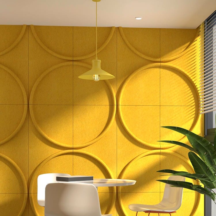 Sunny yellow Solo Arc acoustic panels forming continuous circular textures on a modern wall.