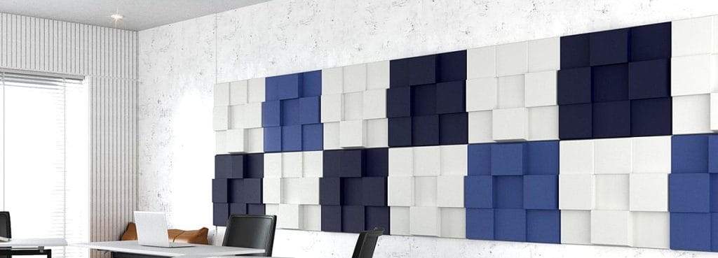 Urban Lumen 3D acoustic panel with raised blue, navy, and white square blocks in a modern office wall installation.