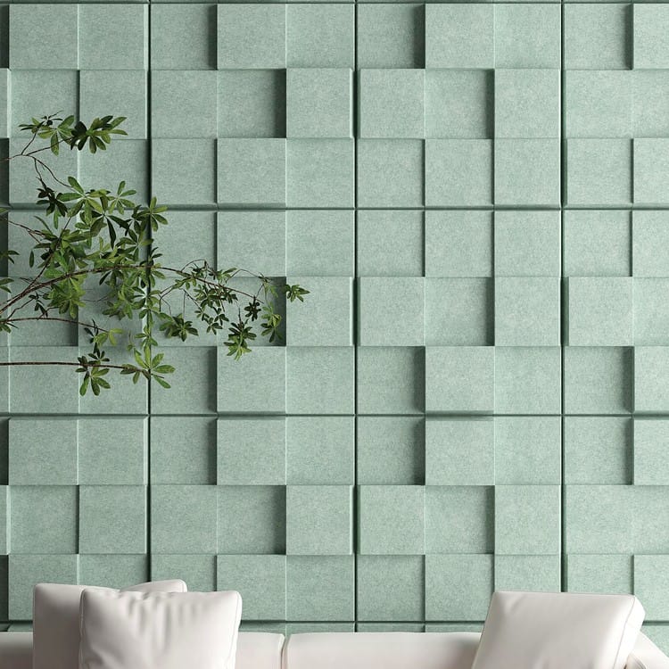 Urban Lumen acoustic panels featuring sage green felt cube blocks creating a textured, dimensionally layered wall surface.