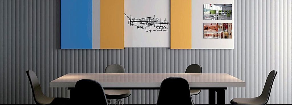 Valen Wave 70mm Acoustic Panel installed on a modern office wall with grey fluted texture and colorful accent panels.
