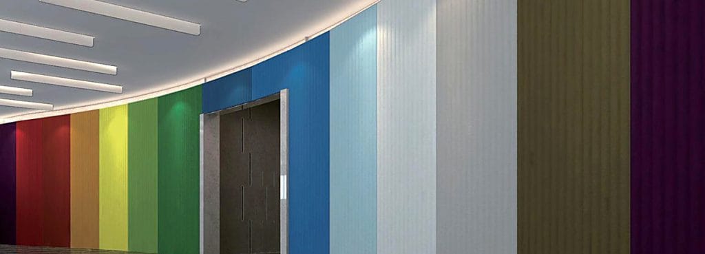 Valen Wave 75mm Acoustic Panel in various vibrant colors installed on a curved wall with soft vertical fluted textures.