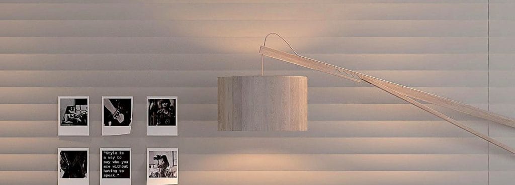 Valen Wave Horizontal Acoustic Panel featuring soft wavy PET felt slats in a neutral tone with a modern wall lamp.