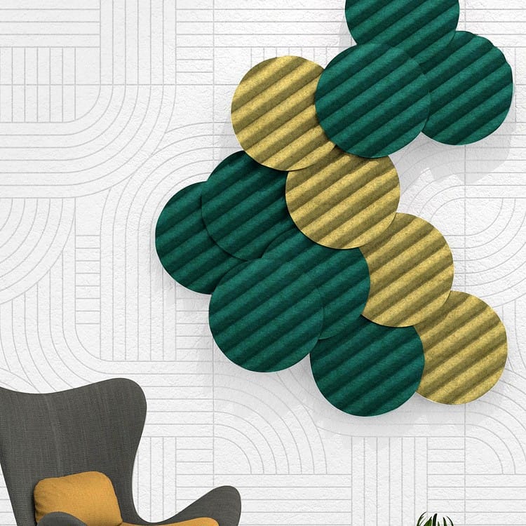Wave Orb circular acoustic panels in emerald green and mustard gold felt arranged in a dimensional wall installation.