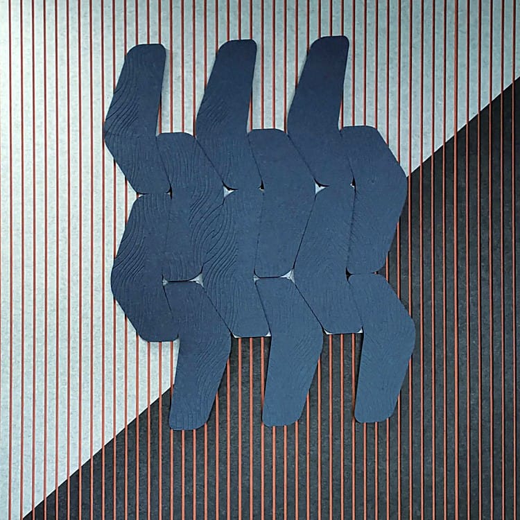 Wide Slat Acoustic Panel background with layered, dark blue geometric PET felt shapes in an overlapping pattern.